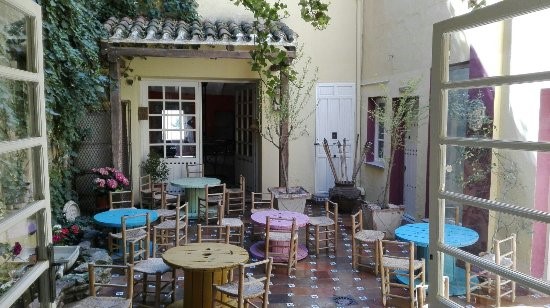 La Nena’s patio, with its fountain (left), adorable tiles, and chairs